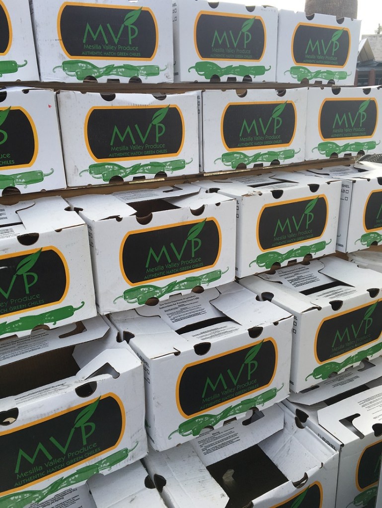 Boxes and boxes of Hatch chile peppers to roast