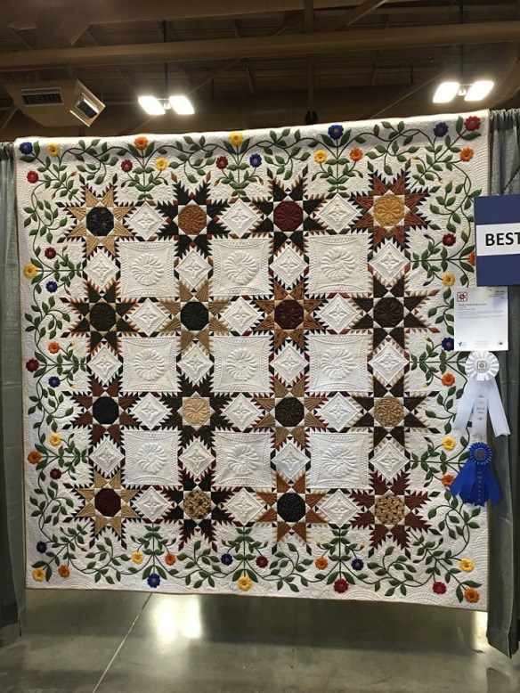 "Paisley Park Feathered Star" won Best in Show quilt by Judy Wolff, quilted by Angela McCorkle